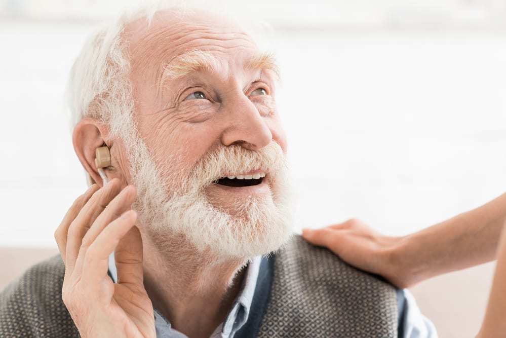 Can you qualify for the disability tax credit with a hearing aid?